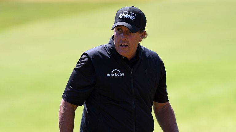 US golfer Phil Mickelson leaves the 17th green during practice at Royal Birkdale golf course near Southport in north west England on July 16, 2017 ahead of