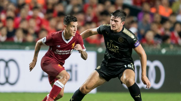 HONG KONG, HONG KONG - JULY 22: Liverpool FC midfielder Philippe Coutinho (L) competes for the ball with Leicester City FC defender Harry Maguire during th