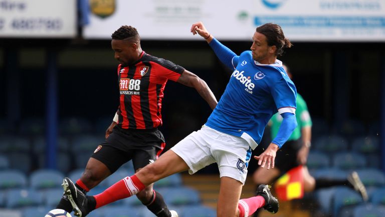 PORTSMOUTH, ENGLAND - JULY 22: Jermain Defoe of AFC Bournemouth and Christian Burgess of Portsmouth in action during a pre-season friendly match between Po