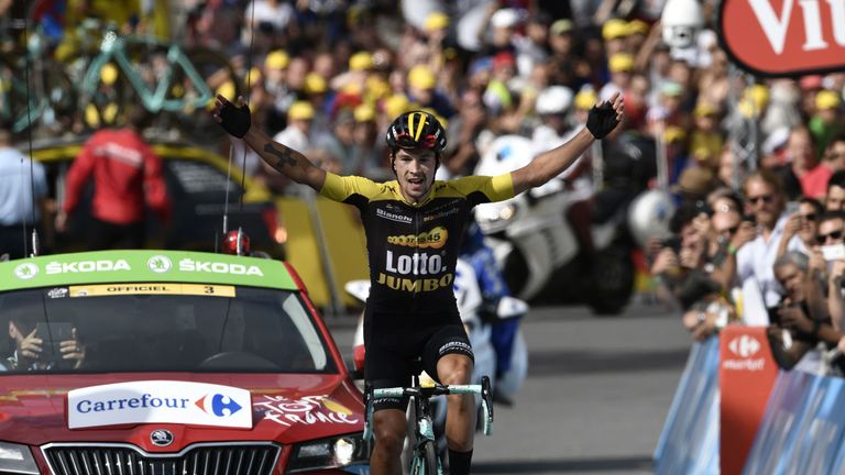 Slovenia's Primoz Roglic celebrates as he crosses the finish line during the 183 km seventeenth stage of the 2017 Tour de France 