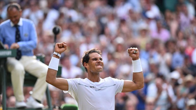 Spain's Rafael Nadal celebrates beating Russia's Karen Khachanov during their men's singles third round match on the fifth day of the 2017 Wimbledon Champi