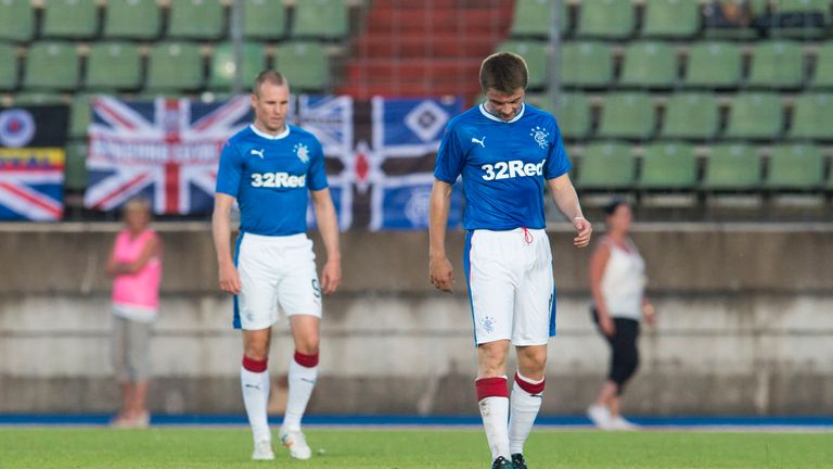 Rangers' Jordan Rossiter (R) and Kenny Miller are dejected after the second goal.