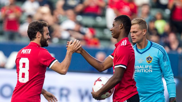 Manchester United Marcus Rashford (L) celebrates his goal with teammate Juan Mata during  during the first half of a national friendly soccer game against 