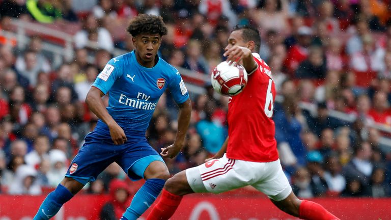 Benfica's Brazilian midfielder Filipe Augusto (R) commits a hand-ball as Arsenal's English midfielder Reiss Nelson tries to pass the ball during the pre-se