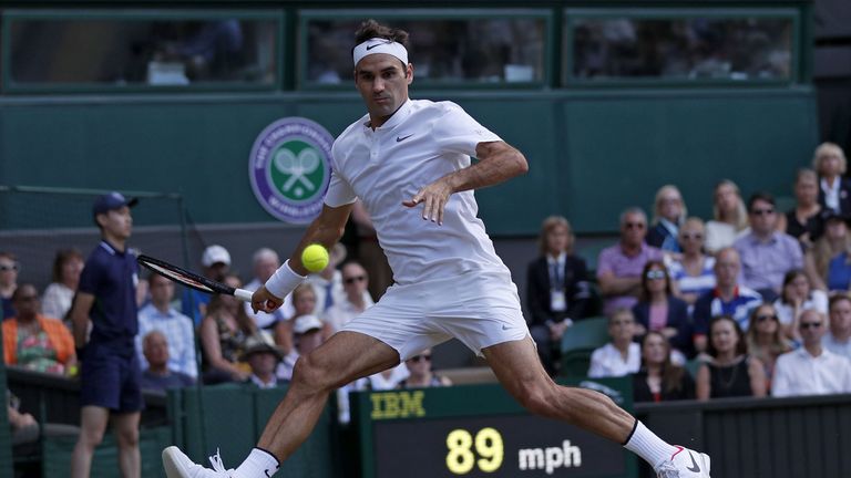 Switzerland's Roger Federer Bulgaria's Grigor Dimitrov during their men's singles fourth round match on the seventh day of the 2017 Wimbledon Championships