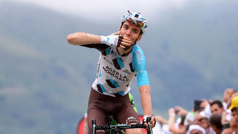 Romain Bardet celebrates crossing the line during stage 12 of the Tour de France