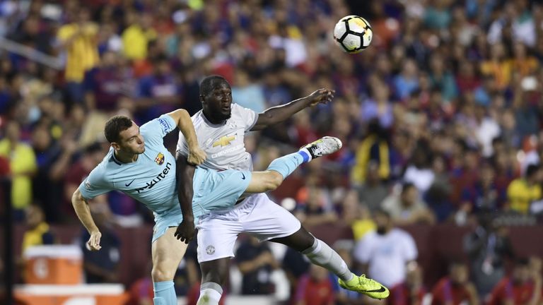 Thomas Vermaelen of Barcelona and Romelu Lukaku of Manchester United fight for the ball during their International Champions Cup (ICC) football match on Ju