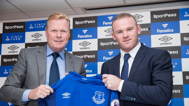 LIVERPOOL, ENGLAND - JULY 10: New Everton Signing Wayne Rooney is given his shirt by Manager Ronald Koeman at Goodison Park on July 10, 2017 in Liverpool, 