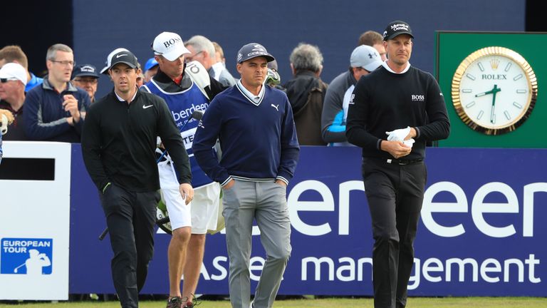 TROON, SCOTLAND - JULY 13:  Rory McIlroy of Northern Ireland, Rickie Fowler of the United States and Henrik Stenson of Sweden walk off the 10th tee during 