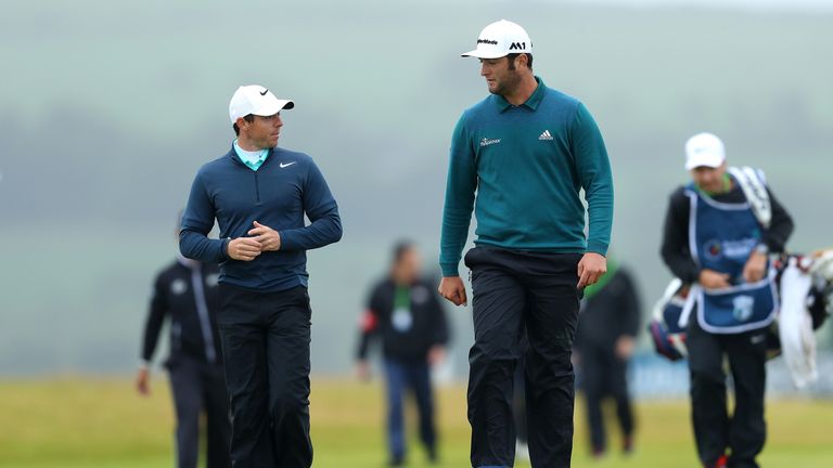 Rory McIlroy of Northern Ireland and Jon Rahm of Spain walk up the 18th hole during day two of the Irish Open