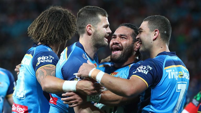 Anthony Don (second from right) is congratulated after scoring a try