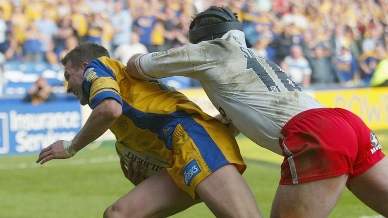 Danny McGuire scores the winning try despite the attentions of Darren Smith of St Helens during the 2003 Challenge Cup semi-final