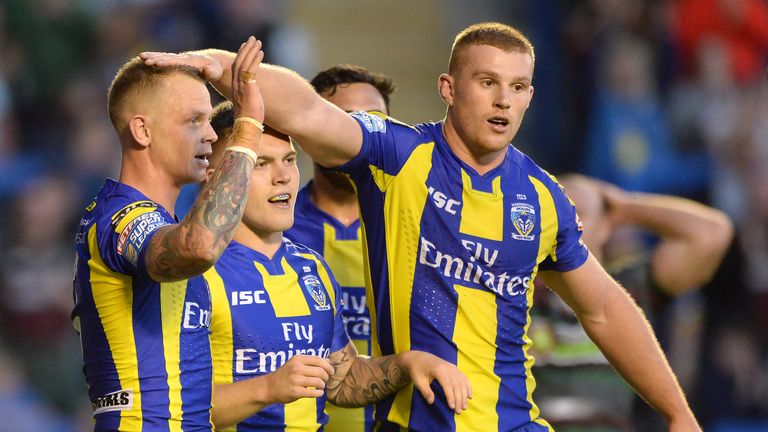 Kevin Brown (left) is congratulated after scoring a try against Widnes