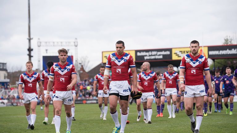 Wakefield leave the field dejected after their loss to Wigan