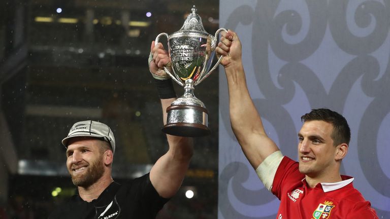Opposing captains Kieran Read of the All Blacks and Sam Warburton of the Lions lift the trophy following series draw