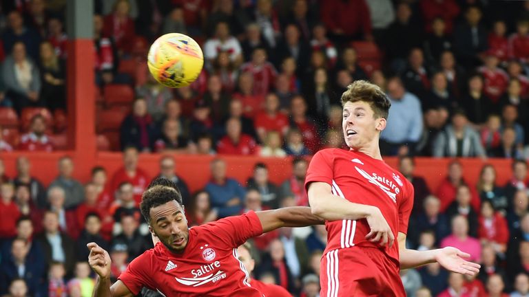 Ryan Christie (right) heads in the opening goal at Pittodrie