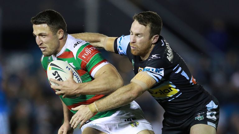 SYDNEY, AUSTRALIA - JULY 21:  Sam Burgess of the Rabbitohs is tackled by James Maloney of the Sharks during the round 20 NRL match between the Cronulla Sha