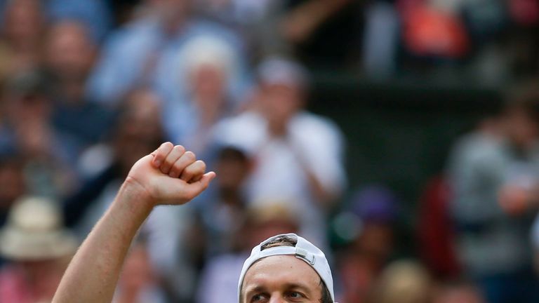 US player Sam Querrey celebrates beating Britain's Andy Murray in their men's singles quarter-final match on the ninth day of the 2017 Wimbledon Championsh