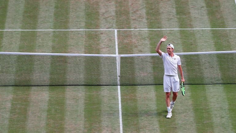 US player Sam Querrey celebrates beating Britain's Andy Murray in their men's singles quarter-final match on the ninth day of the 2017 Wimbledon Championsh