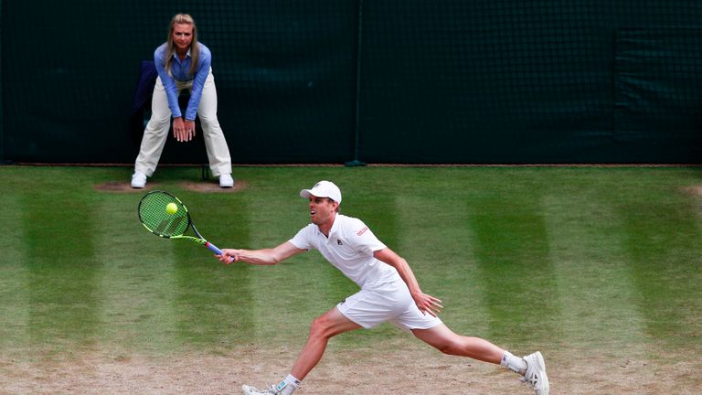 US player Sam Querrey returns against Britain's Andy Murray during their men's singles quarter-final match on the ninth day of the 2017 Wimbledon Champions