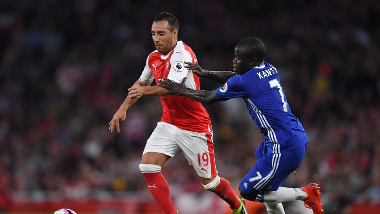 LONDON, ENGLAND - SEPTEMBER 24:  Santi Cazorla of Arsenal (L) takes it past N'Golo Kante of Chelsea (R) during the Premier League match between Arsenal and