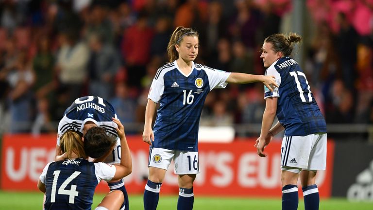 Scotland's defender Frankie Brown (R) and forward Christie Murray (C) react after winning the UEFA Women's Euro 2017 football match against Spain but faili