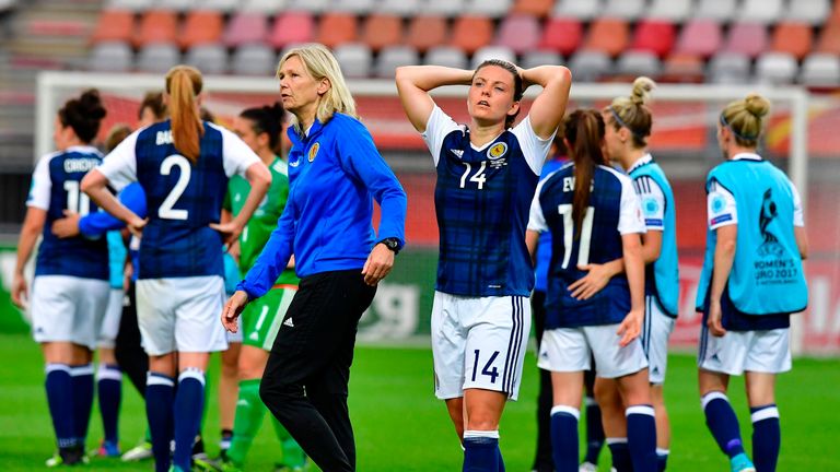 Scotland forward Jane Ross (C) reacts after their defeat to Portugal