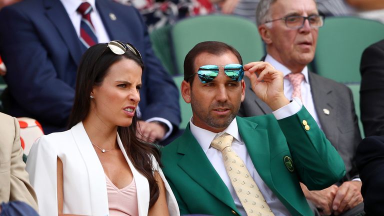 LONDON, ENGLAND - JULY 07:  Golfer Sergio Garcia and fiancee Angela Akins look on from the centre court royal box on day five of the Wimbledon Lawn Tennis 
