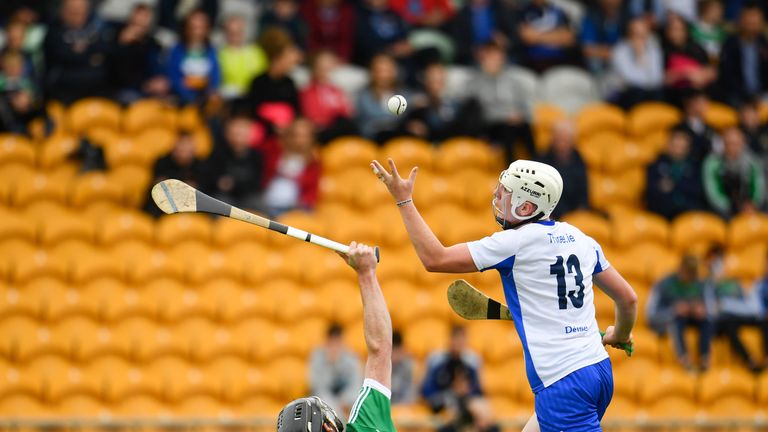 Shane Bennett of Waterford beats Ben Conneely of Offaly on his way to scoring his sides first goal during the Offaly v Waterford match