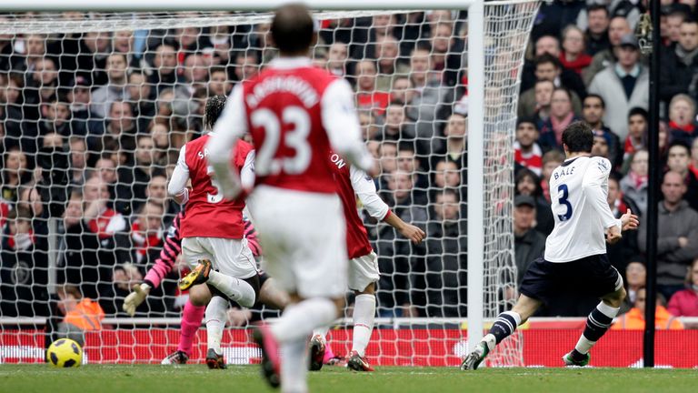 Tottenham Hotspur's Welsh midfielder Gareth Bale (R) scores Tottenham's first goal during the English Premier League football match between Arsenal and Tot