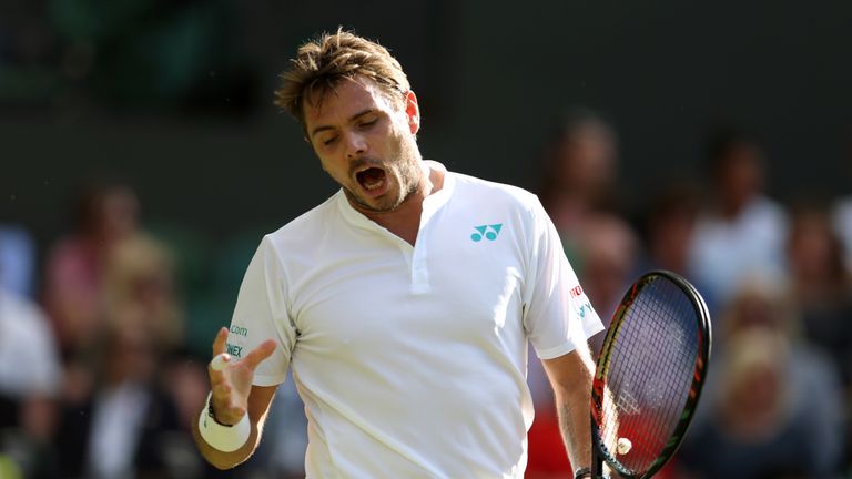 Stan Wawrinka in action against Daniil Madvedev on day one of the Wimbledon Championships at The All England Lawn Tennis and Croquet Club, Wimbledon.