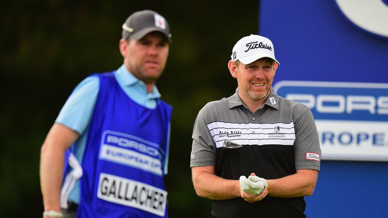 HAMBURG, GERMANY - JULY 28:  Stephen Gallacher of Scotland holds his wrist after playing his first shot on the 6th tee during the Porsche European Open - D