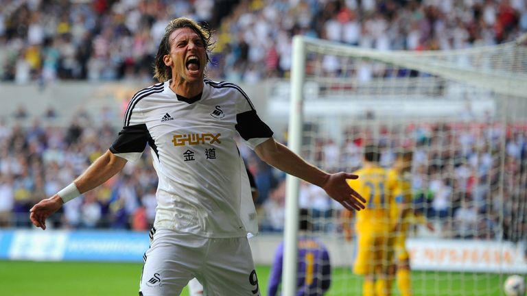 SWANSEA, WALES - AUGUST 22:  Swansea player Michu celebrates after scoring the second swansea goal during the UEFA Europa League play-off first leg between