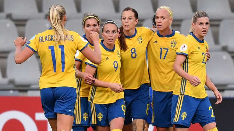 Sweden's Lotta Schelin (C) celebrates with teammates after scoring a penalty against Italy