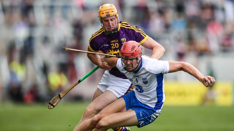 Tadgh De Burca of Waterford in action against Podge Doran of Wexford