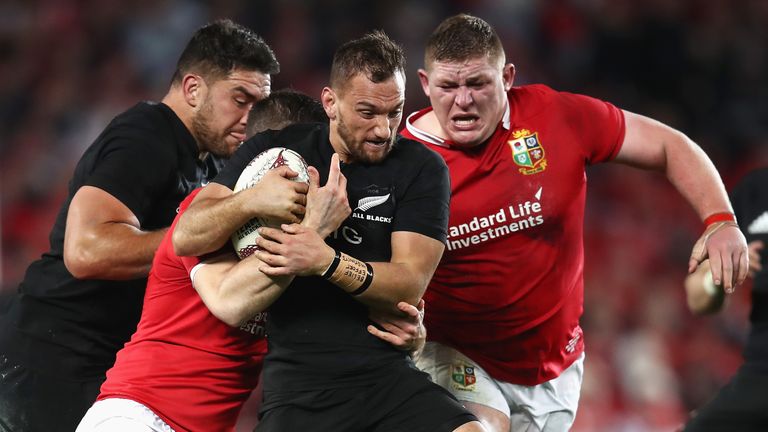 AUCKLAND, NEW ZEALAND - JUNE 24: Aaron Cruden of the All Blacks drives on past Tadhg Furlong of the Lions during the first test match between the New Zeala