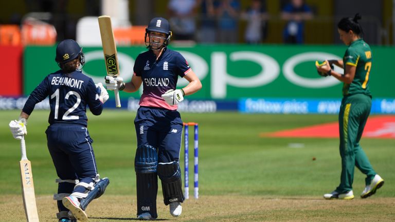 Sarah Taylor celebrates  reaching three figures with fellow centurion Tammy Beaumont against South Africa during the ICC Women's World Cup