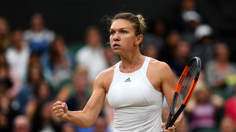 Johanna Konta of Great Britain against Simona Halep of Romania reacts during the Wimbledon quarter-final