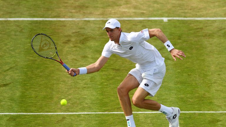 Kevin Anderson of South Africa plays a forehand during the Gentlemen's Singles first round match on day one of the Wimbledon