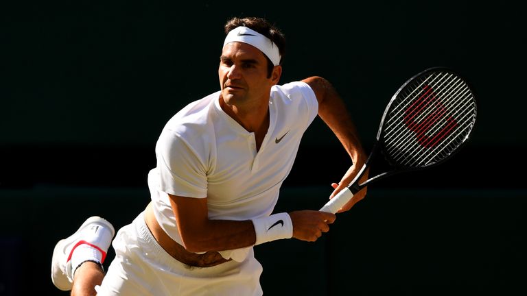 Roger Federer of Switzerland serves during the Gentlemen's Singles semi final match against Tomas Berdych