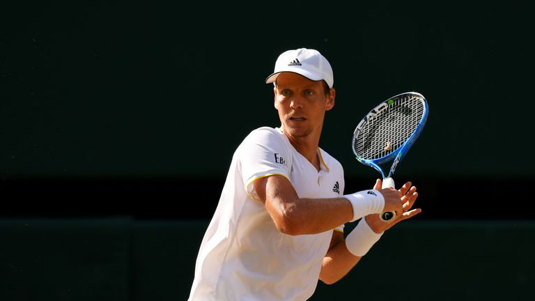 Tomas Berdych of The Czech Republic plays a forehand during the Gentlemen's Singles semi final match against Roger Federer