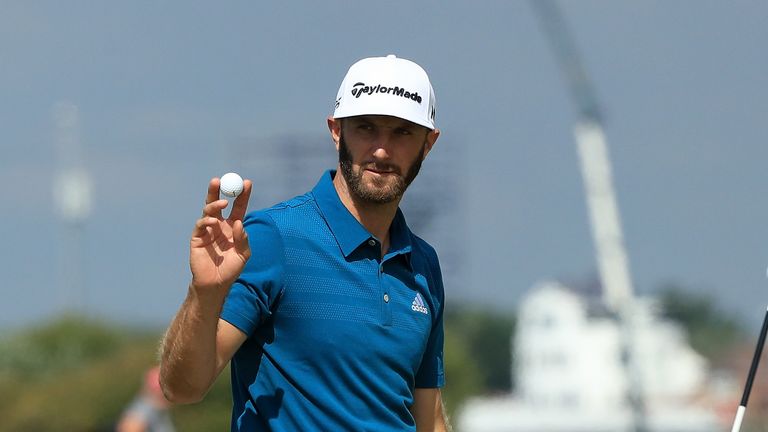 Dustin Johnson of the United States acknowledges the crowd after a birdie on the 15th hole during the third round of The Open