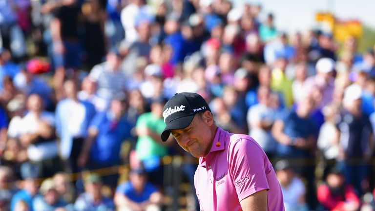 Ian Poulter of England reacts after a putt on the 7th green during the third round of The 146th Open