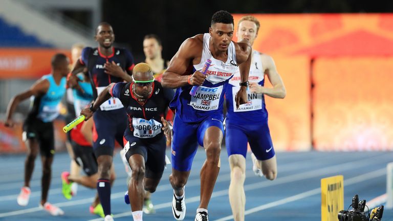 Theo Campbell races ahead of France's Thomas Jordier during the Men's 4 x 400 Relay in Nassau