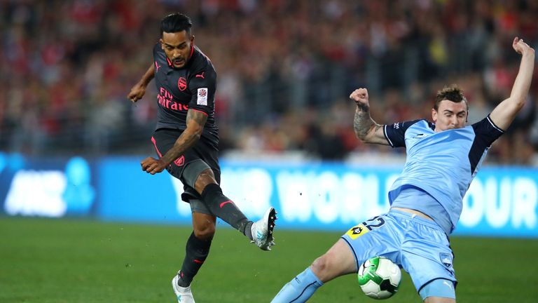 Theo Walcott takes aim during the first half 