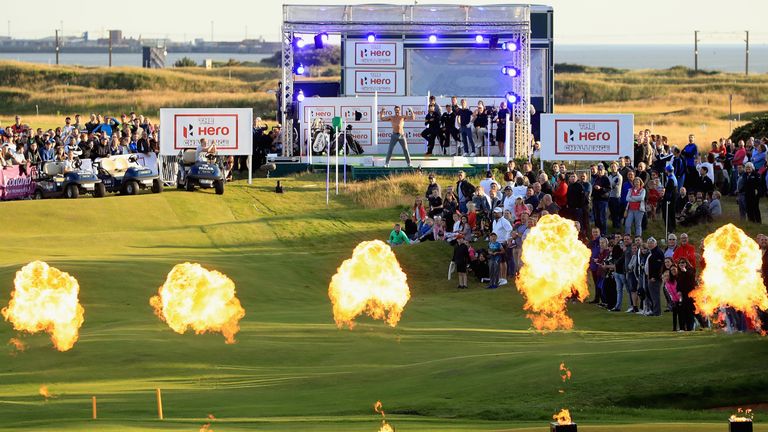 TROON, SCOTLAND - JULY 11:  Thom Evans, former Scottish international rugby union player, plays a shot topless during The Hero Challenge during the AAM Sco