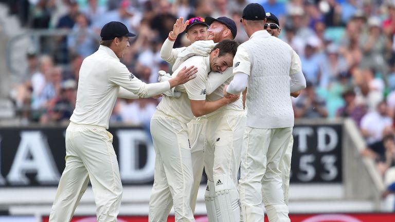 England's Toby Roland-Jones (C) celebrates taking the wicket of South Africa's Vernon Philander on the final day of the third Test