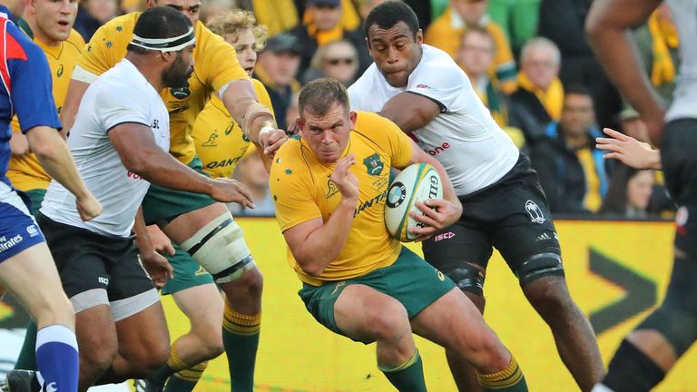 MELBOURNE, AUSTRALIA - JUNE 10:  Toby Smith of the Wallabies runs with the ball during the International Test match