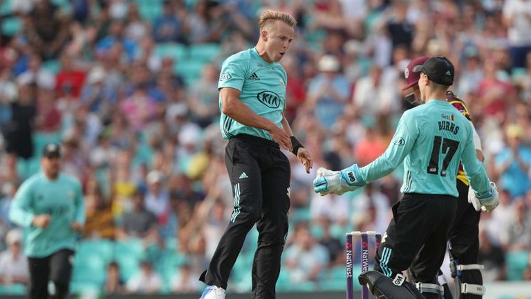 LONDON, ENGLAND - JULY 09: Bowler Tom Curran celebrates with wicket keeper Rory Burns after Surrey win a last ball thriller during the NatWest T20 Blast ma