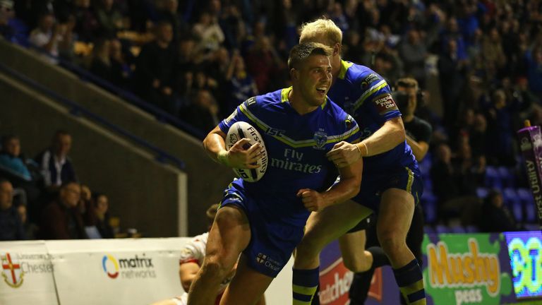 WARRINGTON, ENGLAND - SEPTEMBER 29:  Tom Lineham of Warrington Wolves celebrates after scoring a try with Rhys Evans during the First Utility Super League 